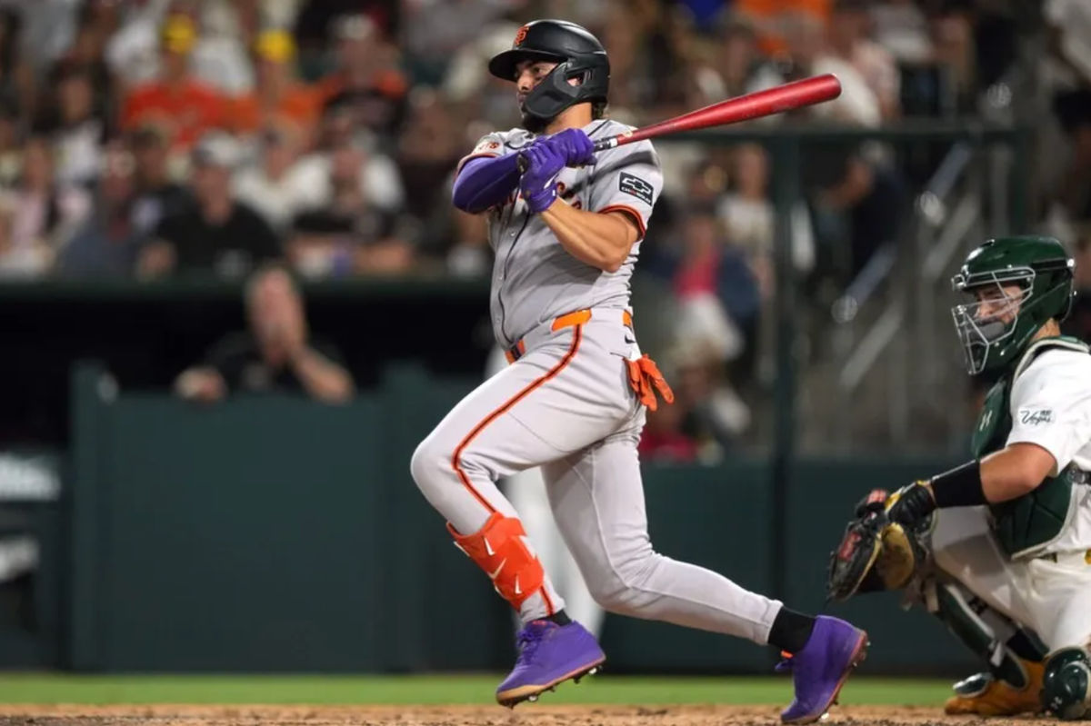 Jul 5, 2025; West Sacramento, California, USA; San Francisco Giants shortstop Willy Adames (2) hits a single against the Athletics during the seventh inning at Sutter Health Park. Mandatory Credit: Darren Yamashita-Imagn Images