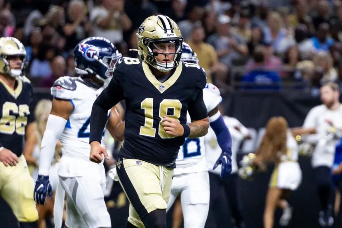 Aug 25, 2024; New Orleans, Louisiana, USA; New Orleans Saints quarterback Spencer Rattler (18) reacts to passing a touchdown against the Tennessee Titans during the first half at Caesars Superdome. Mandatory Credit: Stephen Lew-Imagn Images