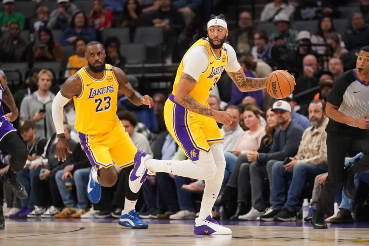 Dec 19, 2024; Sacramento, California, USA; Los Angeles Lakers forward Anthony Davis (3) dribbles the ball next to forward LeBron James (23) against the Sacramento Kings in the first quarter at the Golden 1 Center. Mandatory Credit: Cary Edmondson-Imagn Images