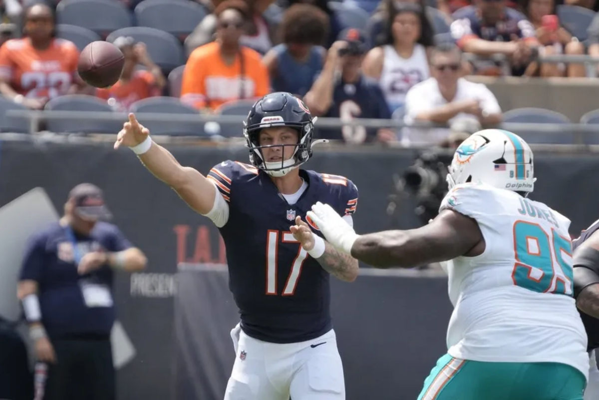 Aug 10, 2025; Chicago, Illinois, USA; Chicago Bears quarterback Tyson Bagent (17) passes the ball around Miami Dolphins defensive tackle Benito Jones (95) during the first half at Soldier Field. Mandatory Credit: David Banks-Imagn Images
