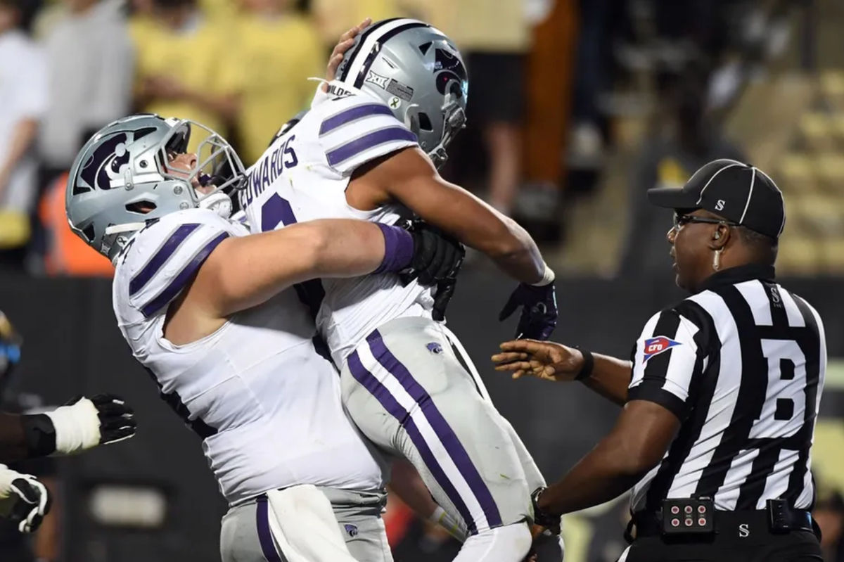 Oct 12, 2024; Boulder, Colorado, USA; Kansas State Wildcats running back Dylan Edwards (3) celebrates with offensive lineman Hadley Panzer (54) after a touchdown during the first half against the Colorado Buffaloes at Folsom Field. Mandatory Credit: Christopher Hanewinckel-Imagn Images