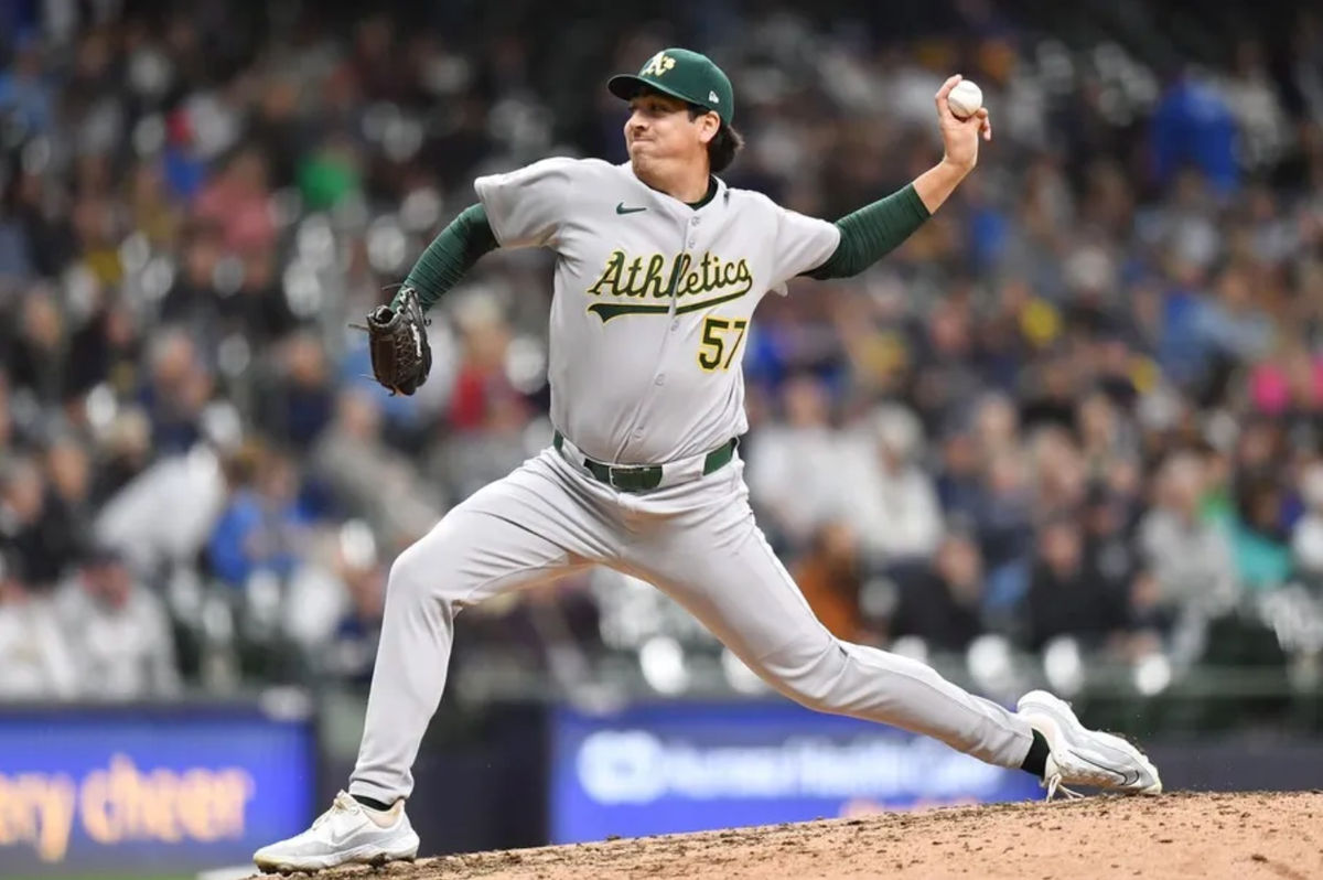 Apr 20, 2025; Milwaukee, Wisconsin, USA; Athletics relief pitcher Jacob Lopez (57) pitches during the seventh inning against the Milwaukee Brewers at American Family Field. Mandatory Credit: Patrick Gorski-Imagn Images