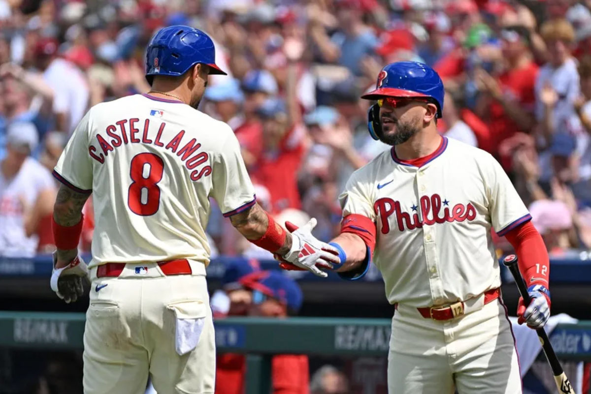 Aug 24, 2025; Philadelphia, Pennsylvania, USA; Philadelphia Phillies outfielder Nick Castellanos (8) celebrates afters scoring a run with outfielder Kyle Schwarber (12) during the second inning against the Washington Nationals at Citizens Bank Park. Mandatory Credit: Eric Hartline-Imagn Images