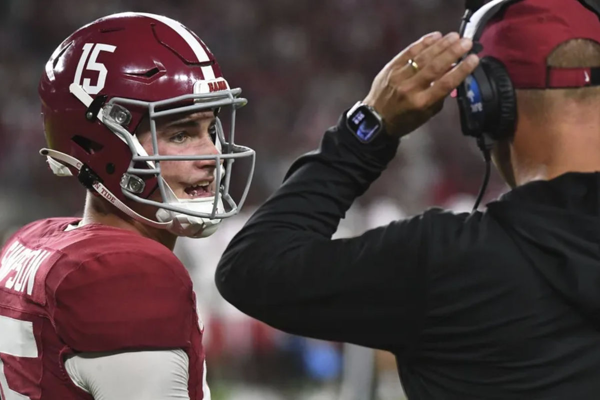 Aug 31, 2024; Tuscaloosa, Alabama, USA; Alabama Crimson Tide quarterback Ty Simpson (15) talks with Alabama Crimson Tide head coach Kalen DeBoer at Bryant-Denny Stadium during the game between the Alabama Crimson Tide and the Western Kentucky Hilltoppers. Alabama defeated Western Kentucky 63-0. Mandatory Credit: Gary Cosby Jr.-Imagn Images