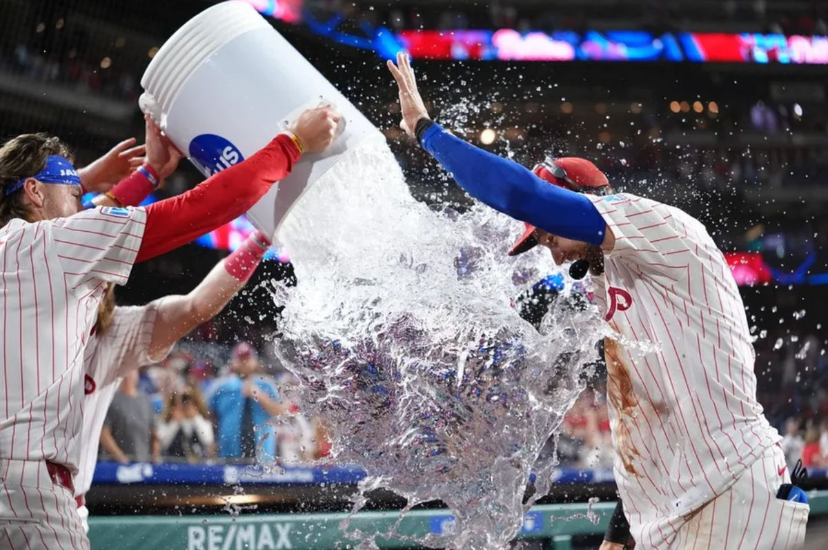 Aug 30, 2025; Philadelphia, Pennsylvania, USA; Philadelphia Phillies infielder Trea Turner (7) is showered by teammates after the game against the Atlanta Braves at Citizens Bank Park. Mandatory Credit: Kyle Ross-Imagn Images