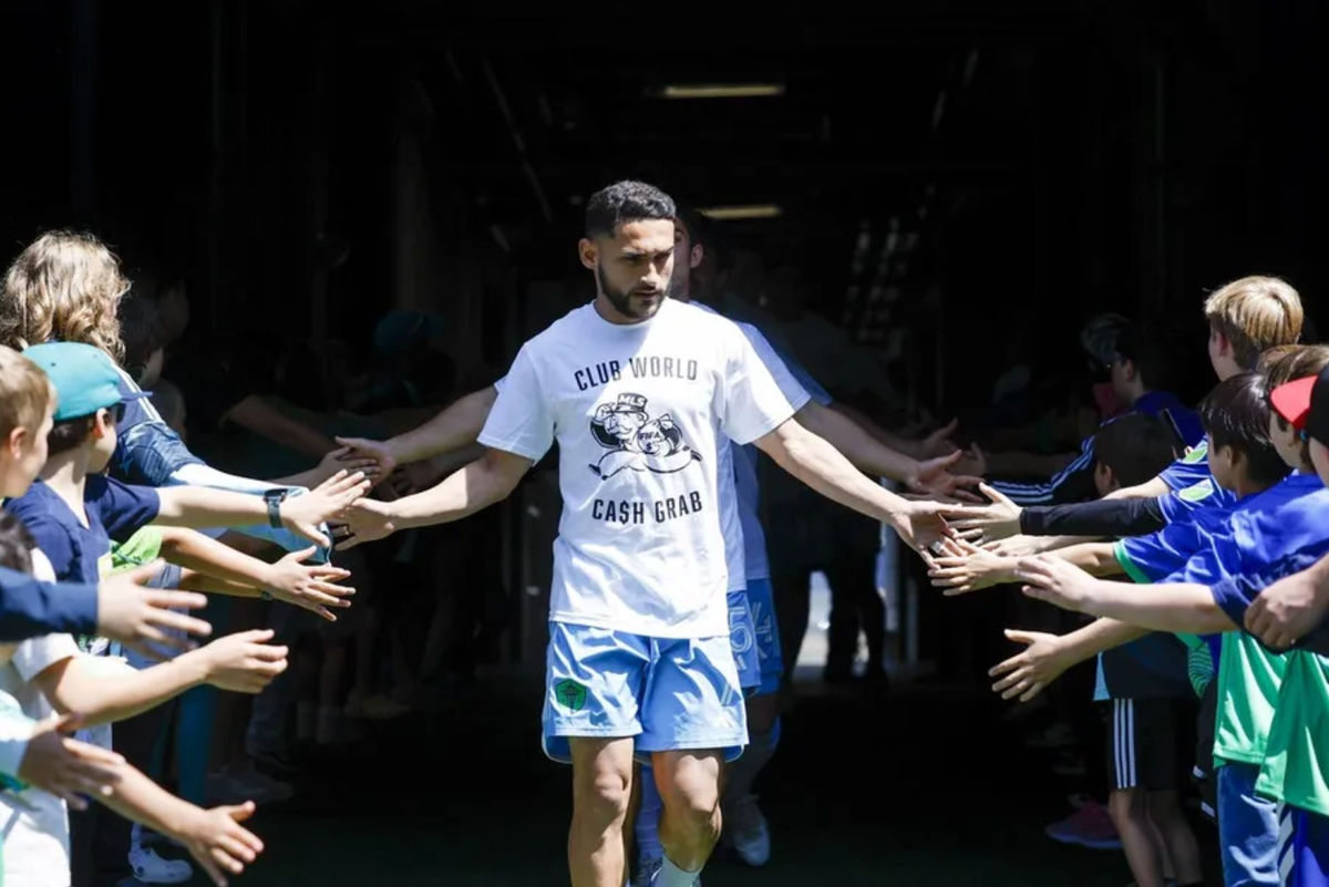 Jun 1, 2025; Seattle, Washington, USA; Seattle Sounders FC midfielder Cristian Roldan (7) wears a t-shirt to protest FIFA Club World Cup bonus sharing from MLS before pregame warmups against the Minnesota United at Lumen Field. Mandatory Credit: Joe Nicholson-Imagn Images