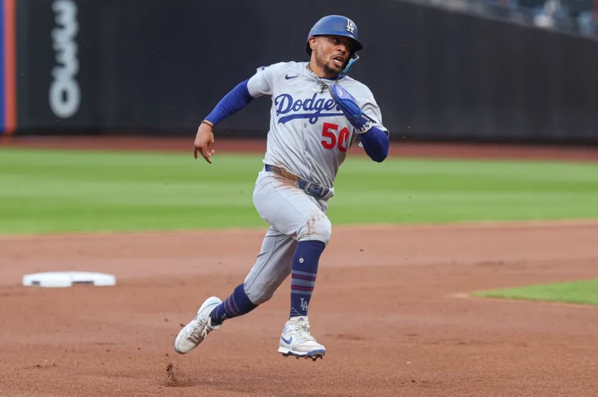 May 25, 2025; New York City, New York, USA;Los Angeles Dodgers shortstop Mookie Betts (50) rounds the bases during a double by first baseman Freddie Freeman ( p) during the first inning against the New York Mets at Citi Field. Mandatory Credit: Vincent Carchietta-Imagn Images