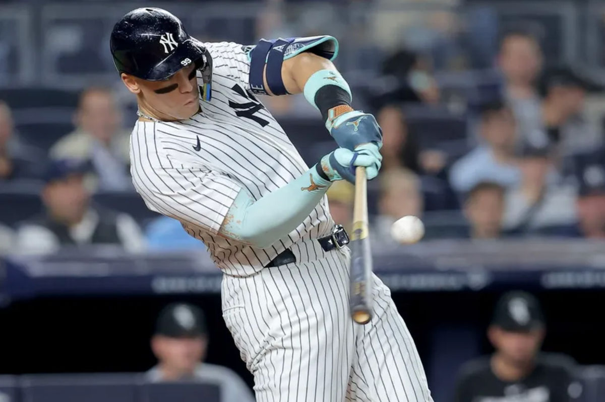 Sep 24, 2025; Bronx, New York, USA; New York Yankees right fielder Aaron Judge (99) hits a three run home run against the Chicago White Sox during the second inning at Yankee Stadium. Mandatory Credit: Brad Penner-Imagn Images