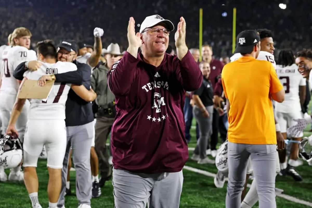 Sep 13, 2025; South Bend, Indiana, USA; Texas A&amp;M Aggies head coach Mike Elko celebrates after the game against Notre Dame Fighting Irish at Notre Dame Stadium. Mandatory Credit: Trevor Ruszkowski-Imagn Images