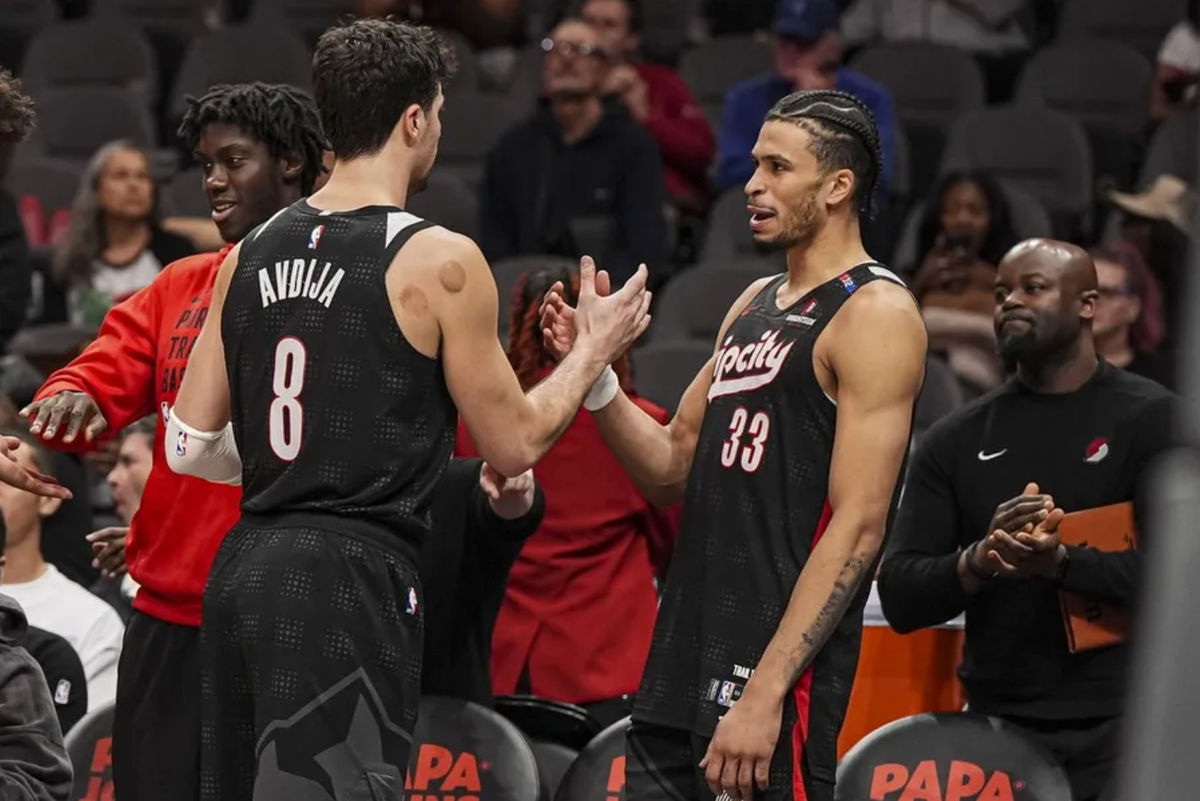 Apr 1, 2025; Atlanta, Georgia, USA; Portland Trail Blazers forwards Deni Avdija (8) and Toumani Camara (33) react late in the game against the Atlanta Hawks during the second half at State Farm Arena. Mandatory Credit: Dale Zanine-Imagn Images