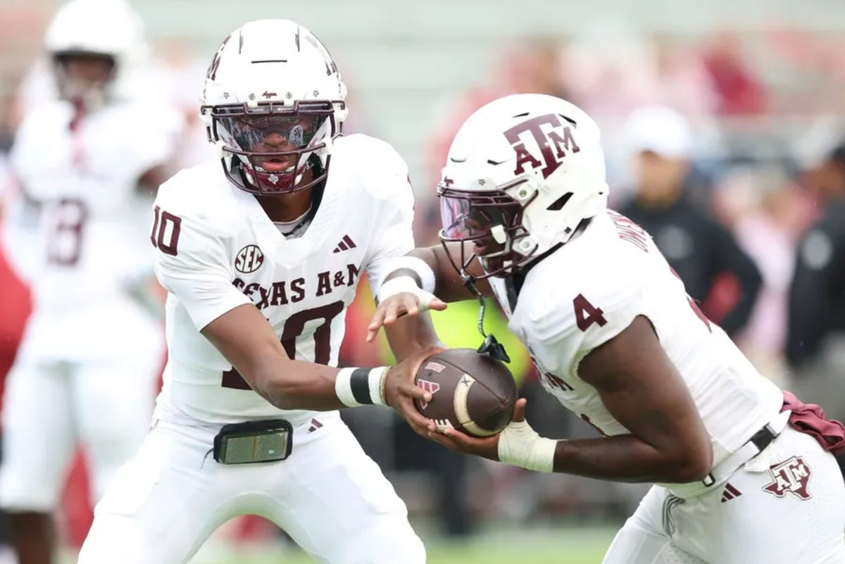 Oct 18, 2025; Fayetteville, Arkansas, USA; Texas A&amp;M Aggies quarterback Marcel Reed (10) and running back Rueben Owens II (4) warm up prior to the game against the Arkansas Razorbacks at Donald W. Reynolds Razorback Stadium. Mandatory Credit: Nelson Chenault-Imagn Images