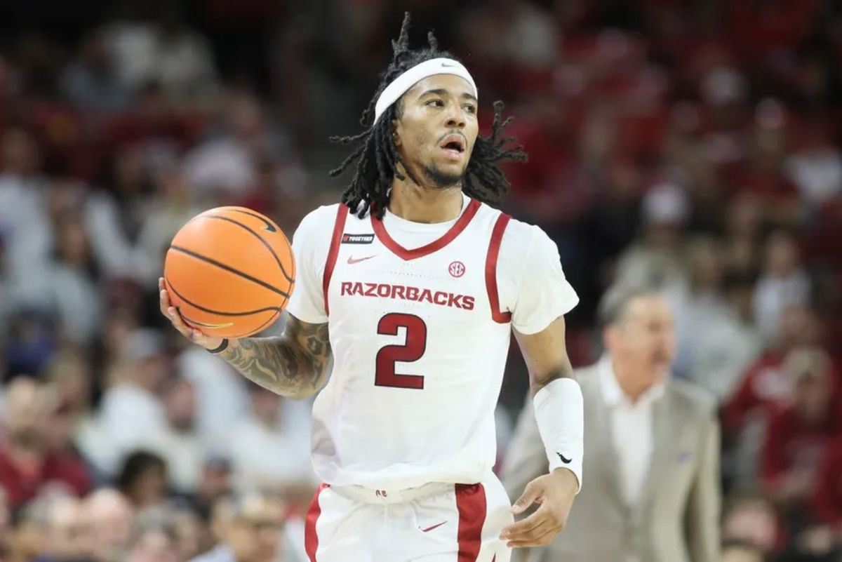 Jan 11, 2025; Fayetteville, Arkansas, USA; Arkansas Razorbacks guard Boogie Fland (2) dribbles during the first half against the Florida Gators at Bud Walton Arena. Mandatory Credit: Nelson Chenault-Imagn Images