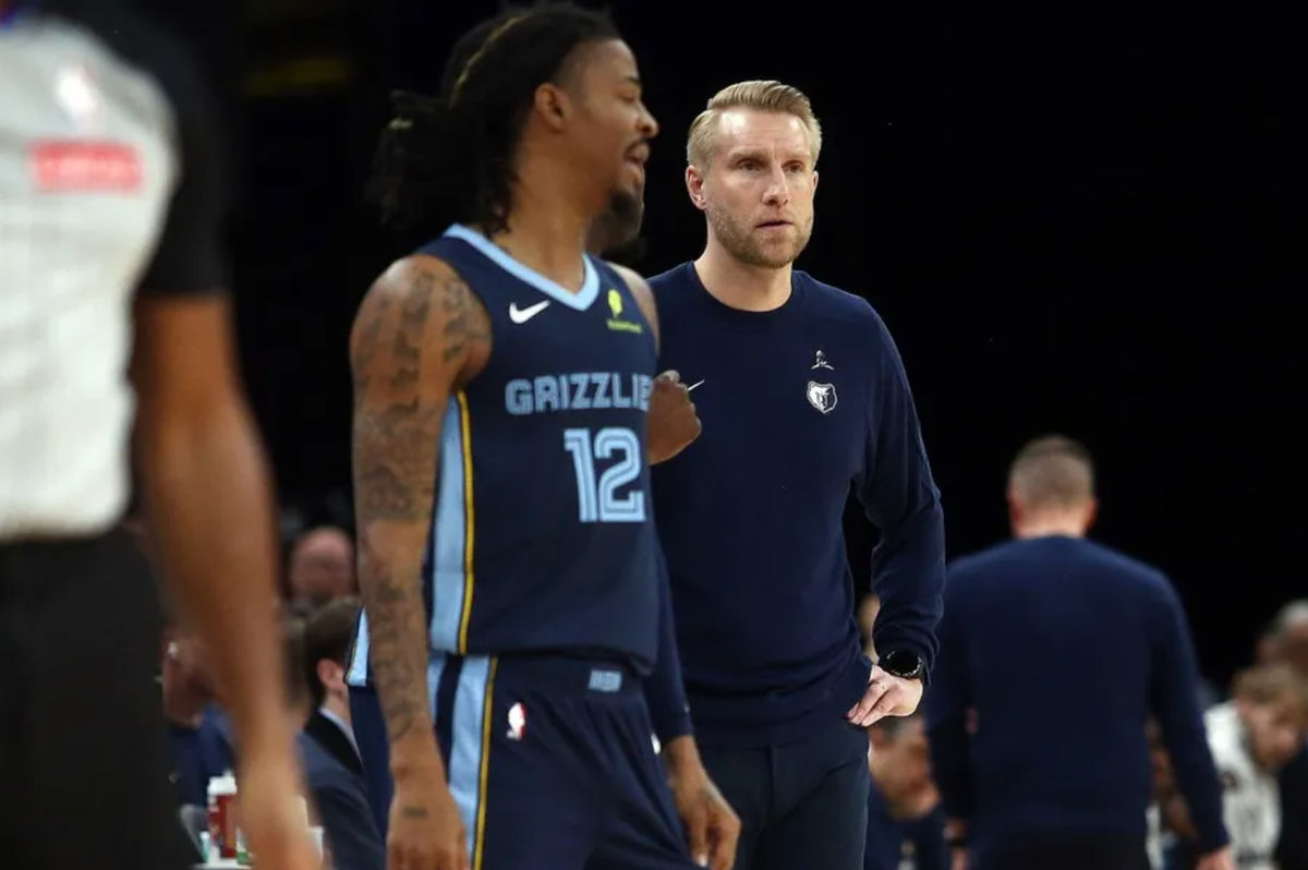 Nov 3, 2025; Memphis, Tennessee, USA; Memphis Grizzlies head coach Tuomas Iisalo looks on as guard Ja Morant (12) checks into the game during the second quarter against the Detroit Pistons at FedExForum. Mandatory Credit: Petre Thomas-Imagn Images