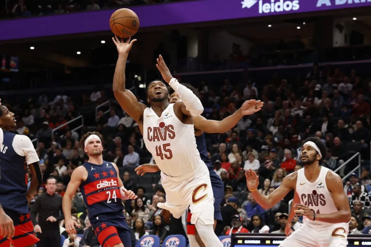 Nov 7, 2025; Washington, District of Columbia, USA; Cleveland Cavaliers guard Donovan Mitchell (45) shoots the ball against the Washington Wizards in the second half in an Emirates NBA Cup game at Capital One Arena. Mandatory Credit: Geoff Burke-Imagn Images