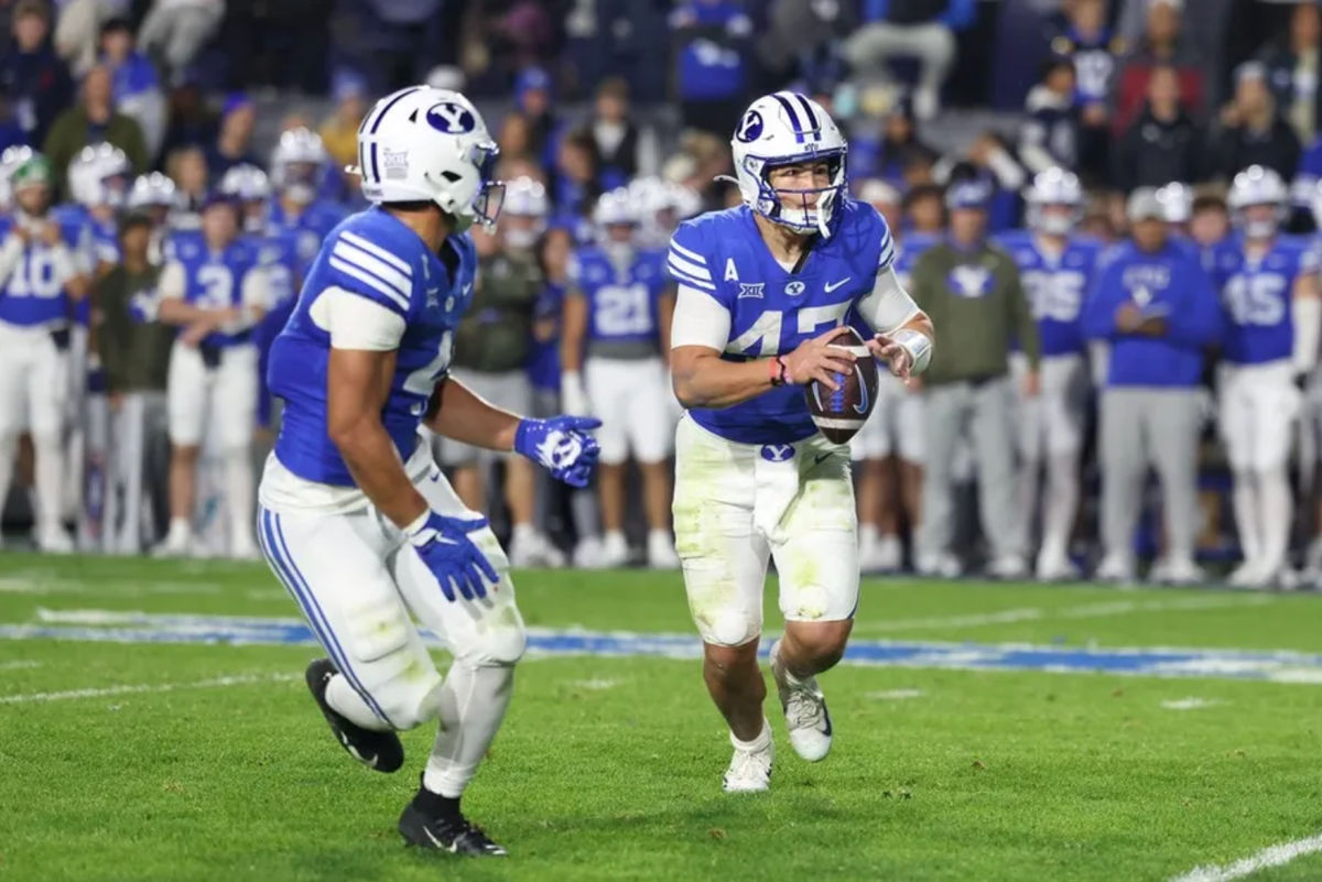 Nov 15, 2025; Provo, Utah, USA; BYU Cougars quarterback Bear Bachmeier (47) plays a run pass option against the Texas Christian University Horned Frogs during the first half at LaVell Edwards Stadium. Mandatory Credit: Rob Gray-Imagn Images