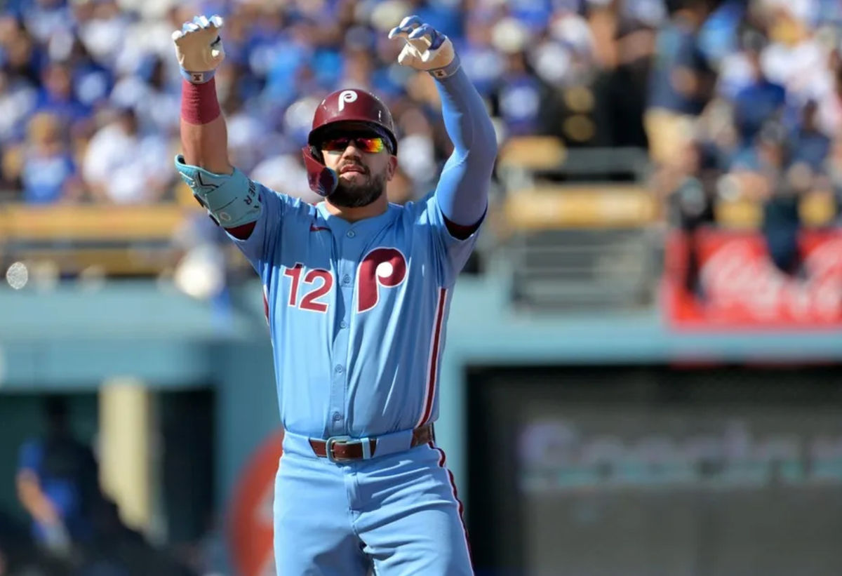 Oct 9, 2025; Los Angeles, California, USA; Philadelphia Phillies left fielder Kyle Schwarber (12) reacts after a double in the first inning against the Los Angeles Dodgers during game four of the NLDS round for the 2025 MLB playoffs at Dodger Stadium. Mandatory Credit: Jayne Kamin-Oncea-Imagn Images