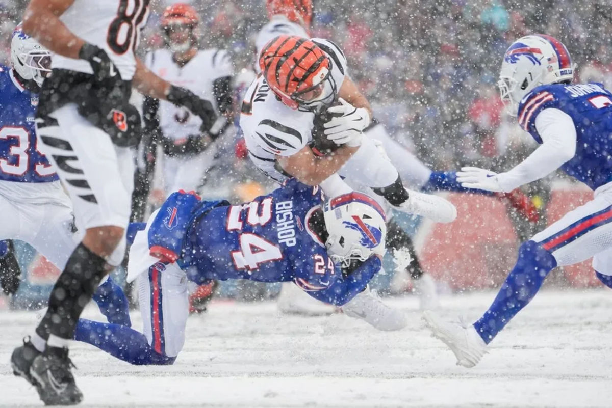 Dec 7, 2025; Orchard Park, New York, USA; Buffalo Bills safety Cole Bishop (24) tackles Cincinnati Bengals tight end Tanner Hudson (87) after a catch in the second quarter at Highmark Stadium. Mandatory Credit: Gregory Fisher-Imagn Images