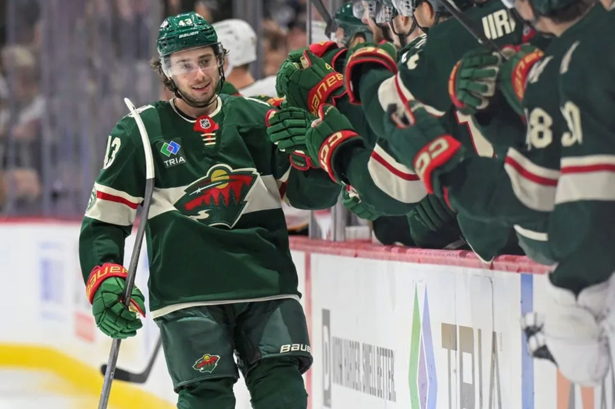 Dec 14, 2025; Saint Paul, Minnesota, USA; Minnesota Wild defensemen Quinn Hughes (43) celebrates after scoring a goal against the Boston Bruins during the third period at Grand Casino Arena. Mandatory Credit: Nick Wosika-Imagn Images
