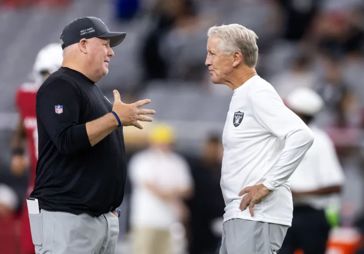 Aug 23, 2025; Glendale, Arizona, USA; Las Vegas Raiders offensive coordinator Chip Kelly (left) with head coach Pete Carroll against the Arizona Cardinals during a preseason NFL game at State Farm Stadium. Mandatory Credit: Mark J. Rebilas-Imagn Images