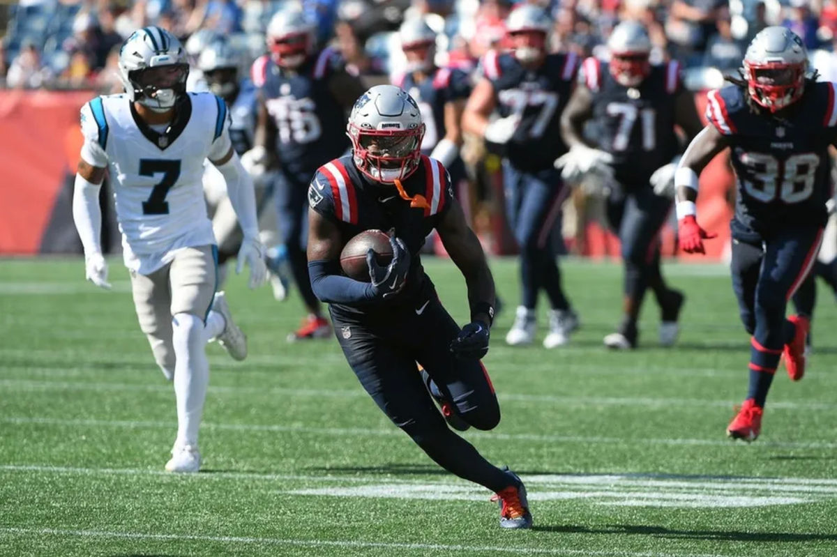 Sep 28, 2025; Foxborough, Massachusetts, USA; New England Patriots wide receiver Stefon Diggs (8) runs with the ball during the second half against the Carolina Panthers at Gillette Stadium. Mandatory Credit: Bob DeChiara-Imagn Images