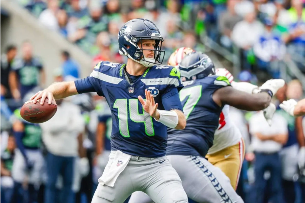Sep 7, 2025; Seattle, Washington, USA; Seattle Seahawks quarterback Sam Darnold (14) passes against the San Francisco 49ers during the fourth quarter at Lumen Field. Mandatory Credit: Joe Nicholson-Imagn Images