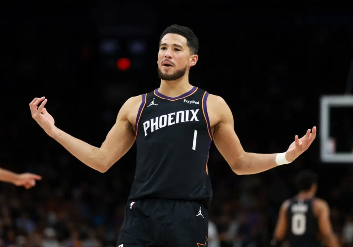Jan 4, 2026; Phoenix, Arizona, USA; Phoenix Suns guard Devin Booker (1) reacts against the Oklahoma City Thunder in the first half at Mortgage Matchup Center. Mandatory Credit: Mark J. Rebilas-Imagn Images