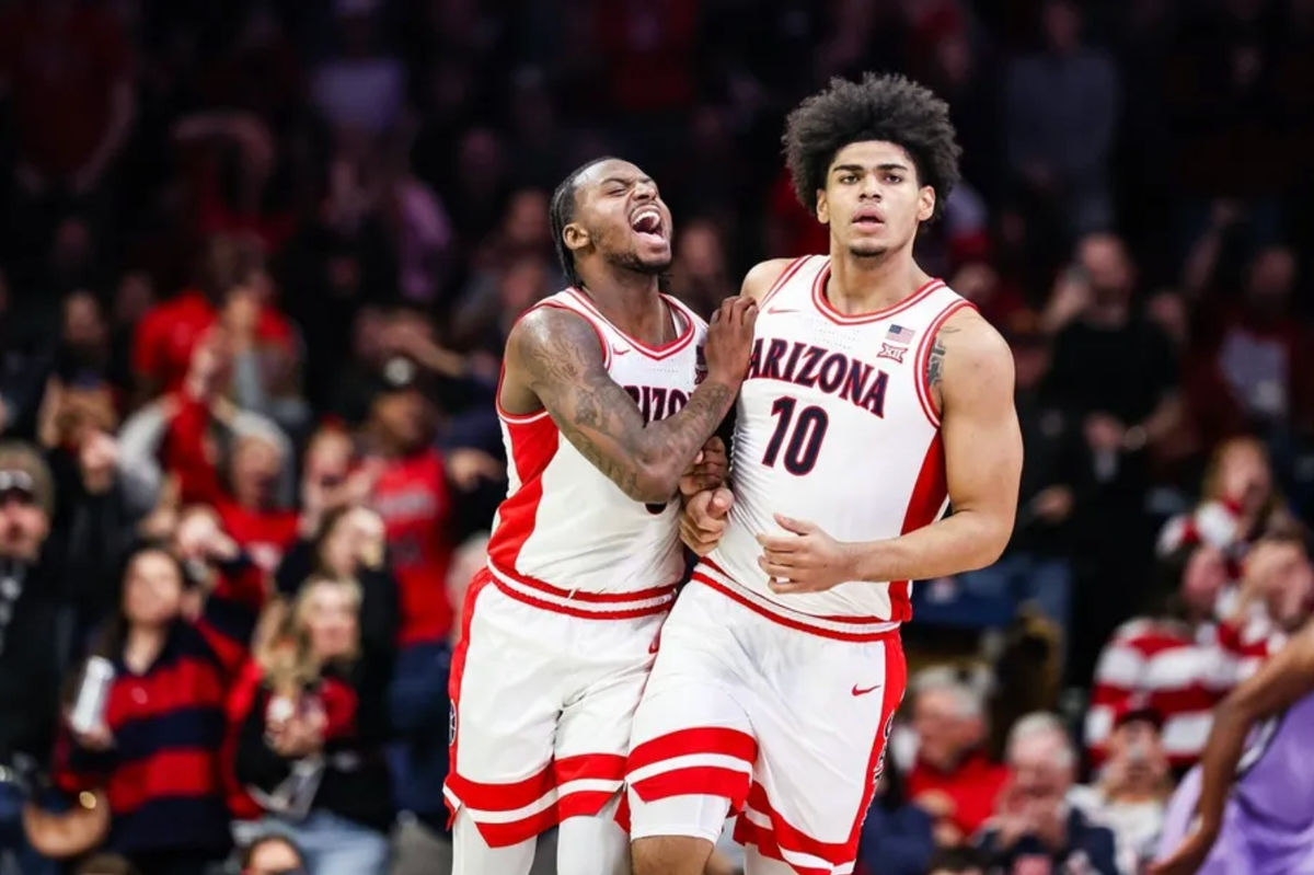 Jan 7, 2026; Tucson, Arizona, USA; Arizona Wildcats guard Jaden Bradley (0) celebrates with forward Koa Peat (10) during the first half of the game against the Kansas State Wildcats at McKale Memorial Center. Mandatory Credit: Aryanna Frank-Imagn Images