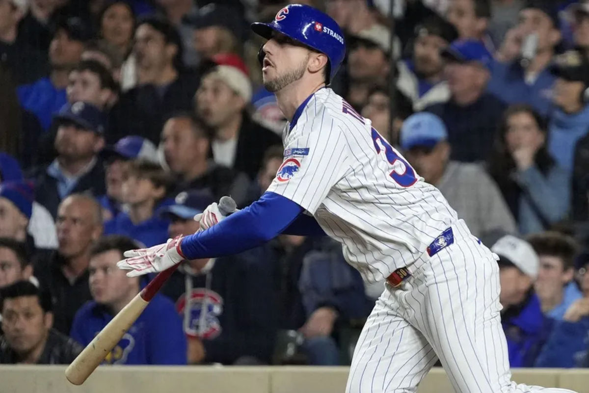 Oct 9, 2025; Chicago, Illinois, USA; Chicago Cubs right fielder Kyle Tucker (30) hits a home run against the Milwaukee Brewers during the seventh inning for game four of the NLDS round for the 2025 MLB playoffs at Wrigley Field. Mandatory Credit: David Banks-Imagn Images