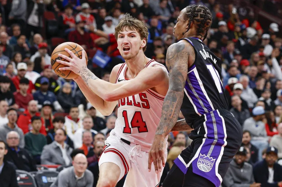 Oct 29, 2025; Chicago, Illinois, USA; Chicago Bulls forward Matas Buzelis (14) drives to the basket against Sacramento Kings guard DeMar DeRozan (10) during the first half at United Center. Mandatory Credit: Kamil Krzaczynski-Imagn Images