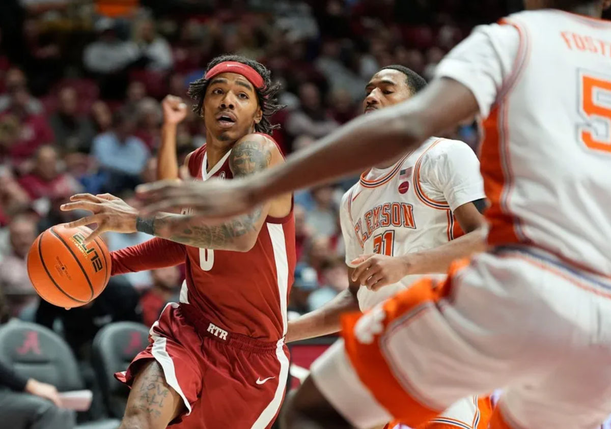 Dec 3, 2025; Tuscaloosa, AL, USA; Alabama guard Labaron Philon Jr. (0) drives against Clemson guard Ace Buckner (21) and Clemson guard Zac Foster (5) at Coleman Coliseum. Mandatory Credit: Gary Cosby Jr.-Tuscaloosa News