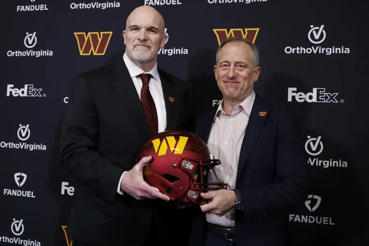 Feb 5, 2024; Ashburn, VA, USA; Washington Commanders head coach Dan Quinn (L) poses for a picture with Commanders managing partner Josh Harris (R) at Quinn's introductory press conference at Commanders Park. Mandatory Credit: Geoff Burke-Imagn Images