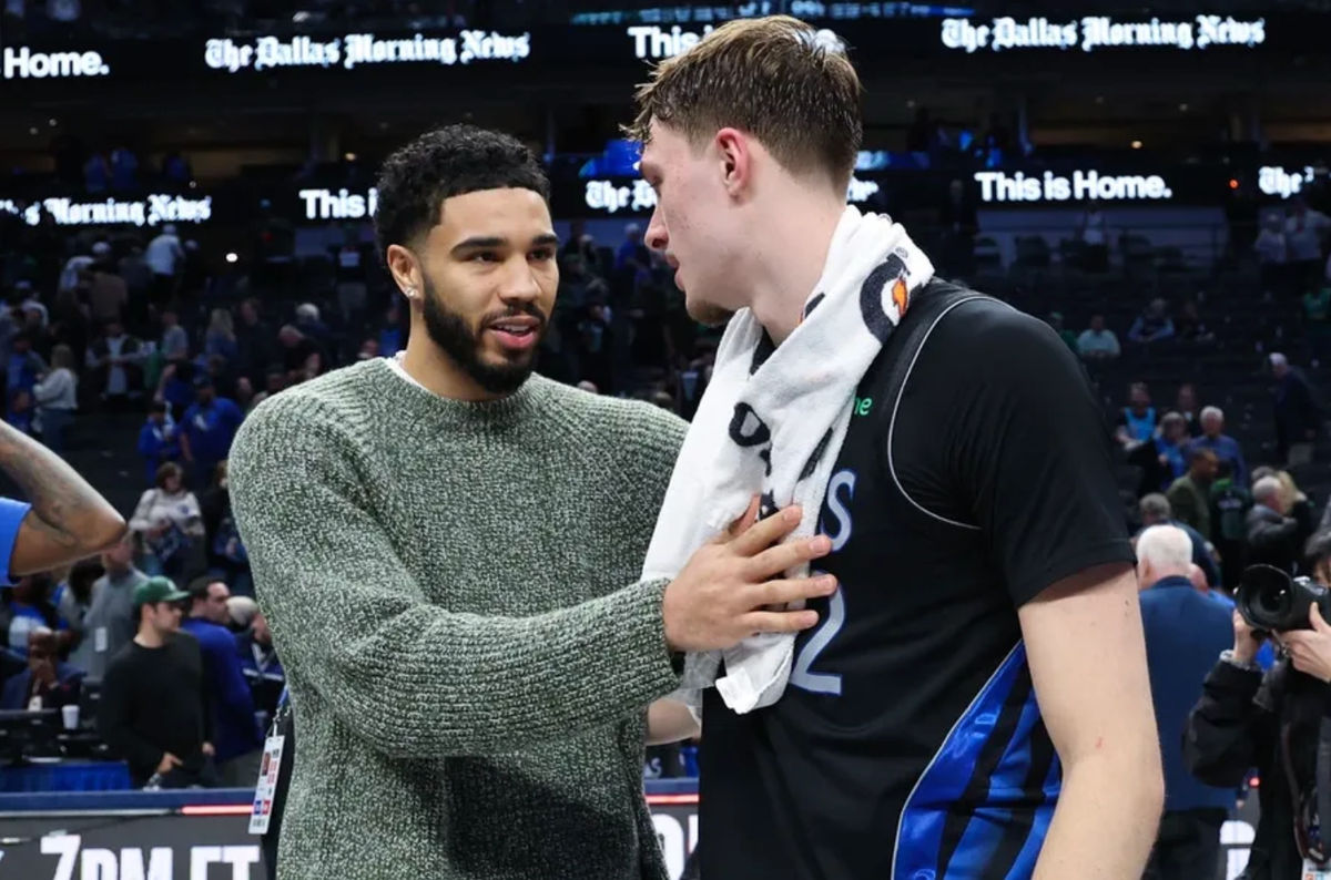 Feb 3, 2026; Dallas, Texas, USA; Dallas Mavericks forward Cooper Flagg (32) hugs Boston Celtics forward Jayson Tatum after the game at American Airlines Center. Mandatory Credit: Kevin Jairaj-Imagn Images