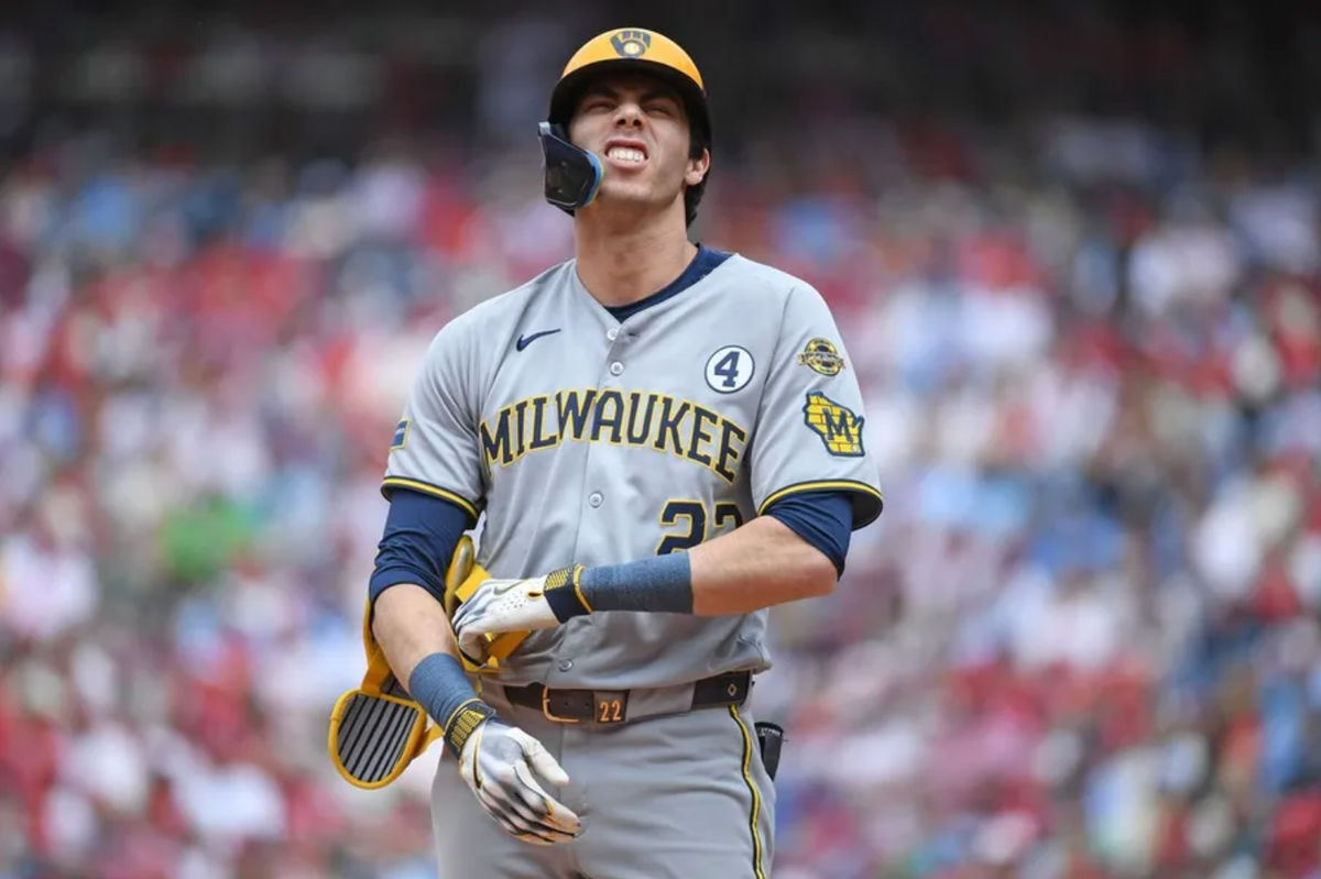Jun 1, 2025; Philadelphia, Pennsylvania, USA; Milwaukee Brewers outfielder Christian Yelich (22) reacts after being hit boy a pitch during the first inning against the Philadelphia Phillies at Citizens Bank Park. Mandatory Credit: Eric Hartline-Imagn Images