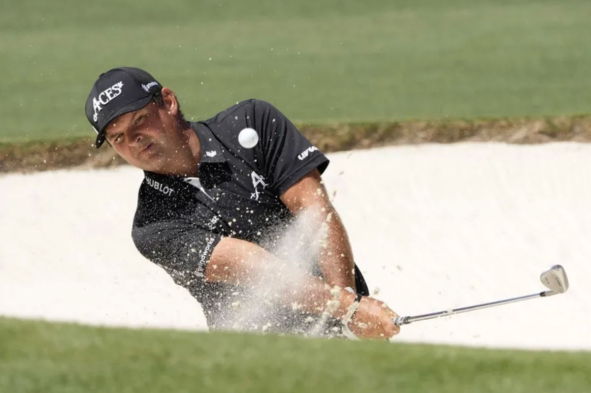 Apr 13, 2025; Augusta, Georgia, USA; Patrick Reed plays a shot from a bunker on the second hole during the final round of the Masters Tournament at Augusta National Golf Club. Mandatory Credit: Michael Madrid-Imagn Images