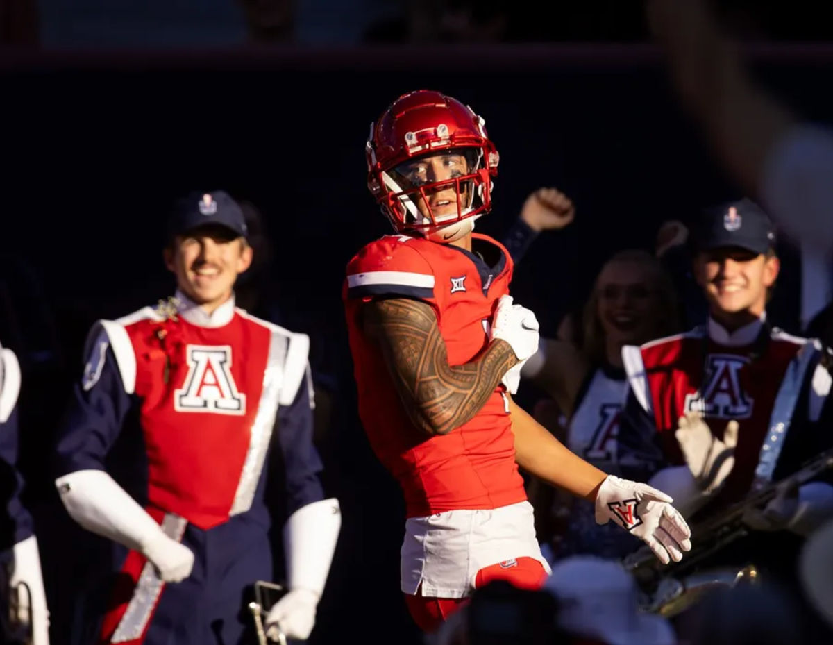 Nov 30, 2024; Tucson, Arizona, USA; Arizona Wildcats wide receiver Tetairoa McMillan (4) celebrates a touchdown against the Arizona State Sun Devils in the second half during the Territorial Cup at Arizona Stadium. Mandatory Credit: Mark J. Rebilas-Imagn Images