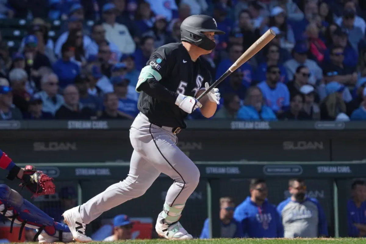 Feb 20, 2026; Mesa, Arizona, USA; Chicago White Sox third baseman Munetaka Murakami (5) hits a single against the Chicago Cubs in the third inning at Sloan Park. Mandatory Credit: Rick Scuteri-Imagn Images