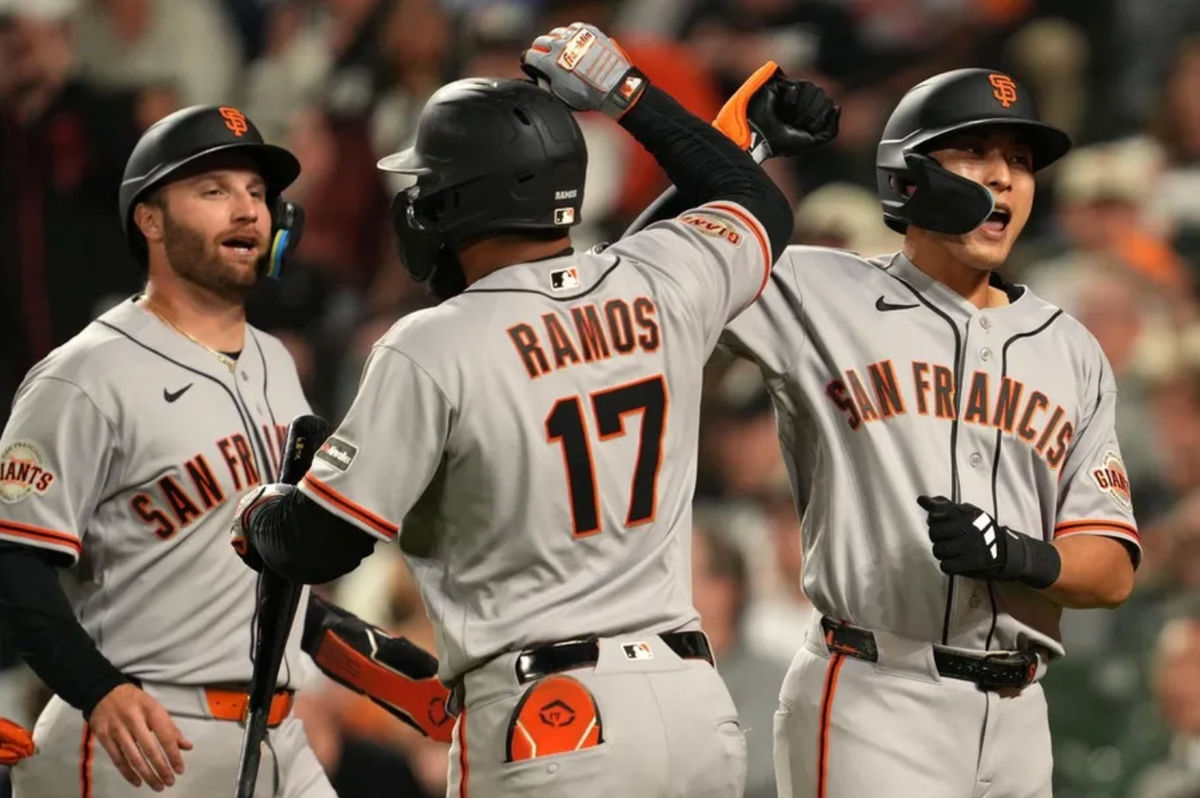 Apr 10, 2026; Baltimore, Maryland, USA; San Francisco Giants outfielder Jung Hoo Lee (right) greeted by designated hitter Casey Schmitt (left) and outfielder Heliot Ramons (center) following his two run home run during the seventh inning against the Baltimore Orioles at Oriole Park at Camden Yards. Mandatory Credit: Mitch Stringer-Imagn Images