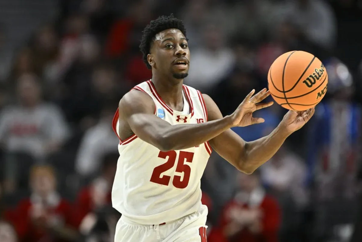 Mar 19, 2026; Portland, OR, USA; Wisconsin Badgers guard John Blackwell (25) passes against the High Point Panthers during the first half of a first round game of the men's 2026 NCAA Tournament at Moda Center. Mandatory Credit: Craig Strobeck-Imagn Images