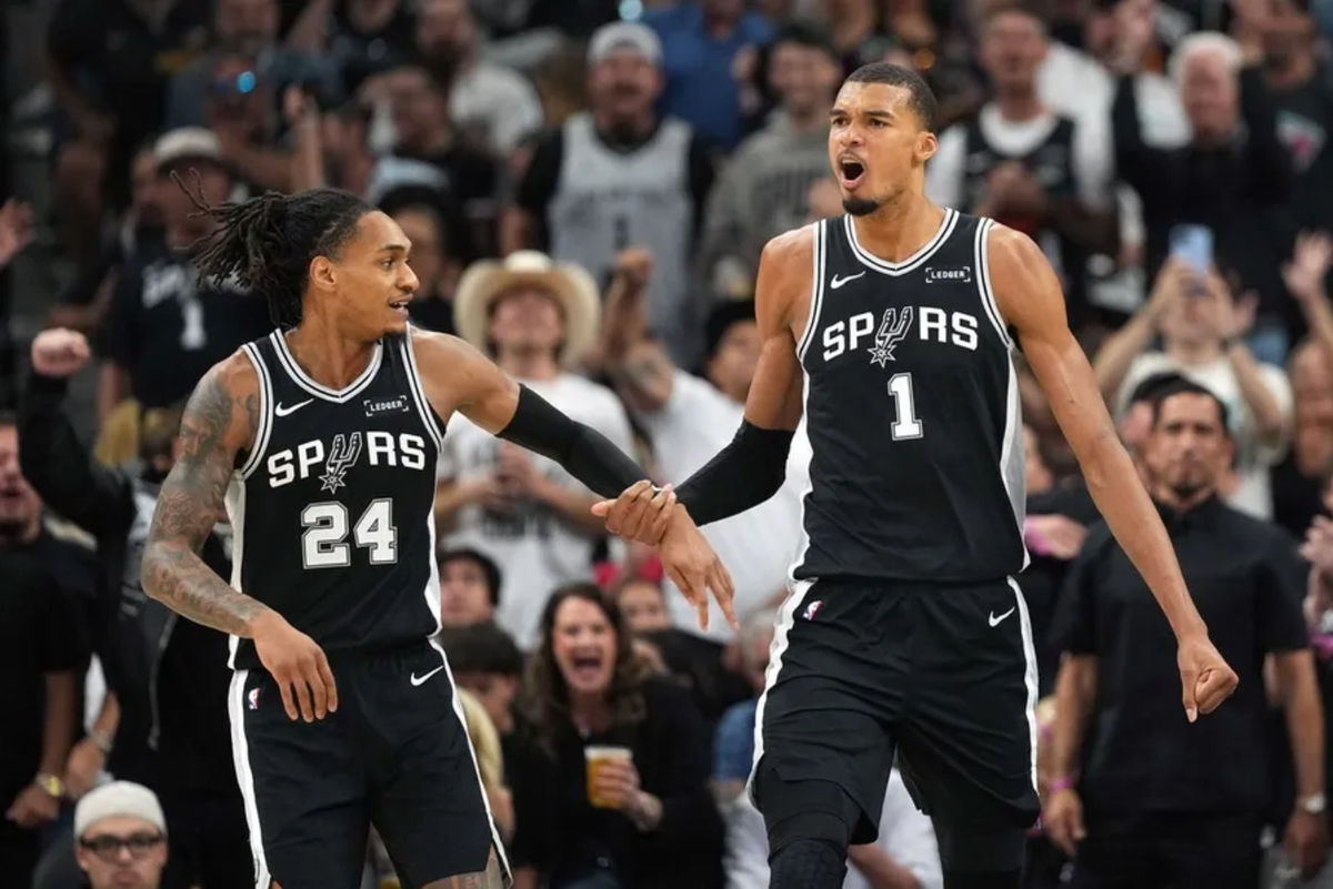 May 12, 2026; San Antonio, Texas, USA; San Antonio Spurs forward Victor Wembanyama and guard Devin Vassell (24) react during the first half of game five of the second round of the 2026 NBA Playoffs against the Minnesota Timberwolves at Frost Bank Center. Mandatory Credit: Scott Wachter-Imagn Images