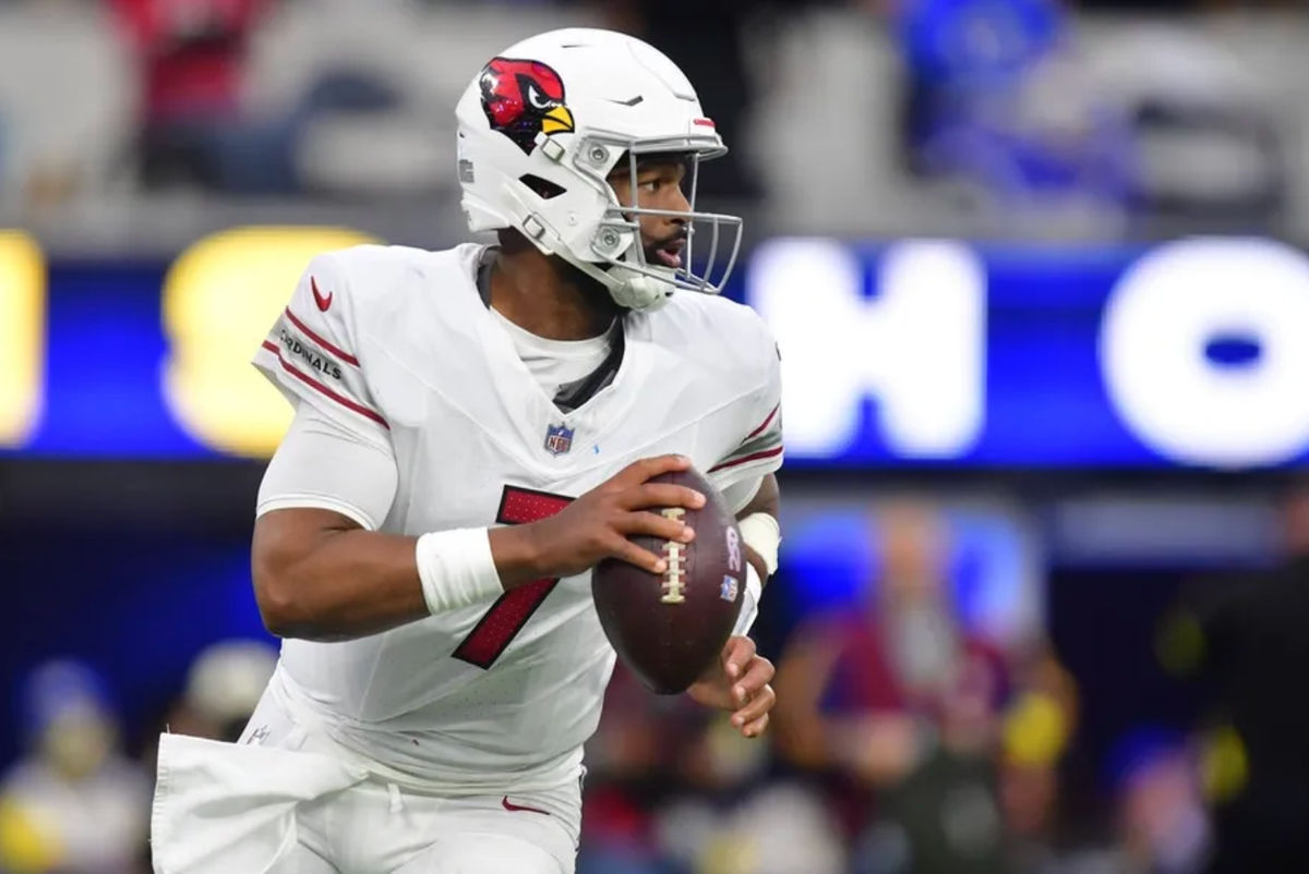 Jan 4, 2026; Inglewood, California, USA; Arizona Cardinals quarterback Jacoby Brissett (7) rolls out against the Los Angeles Rams during the second half at SoFi Stadium. Mandatory Credit: Gary A. Vasquez-Imagn Images