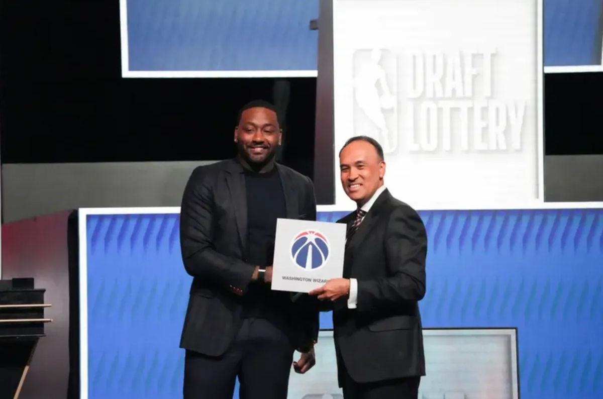May 10, 2026; Chicago, IL, USA; Mark Tatum the NBA Deputy Commissioner and Washington Wizard (left) guard John Wall pose for photos after Wizards won the 2026 NBA Draft Lottery at Navy Pier. Mandatory Credit: David Banks-Imagn Images