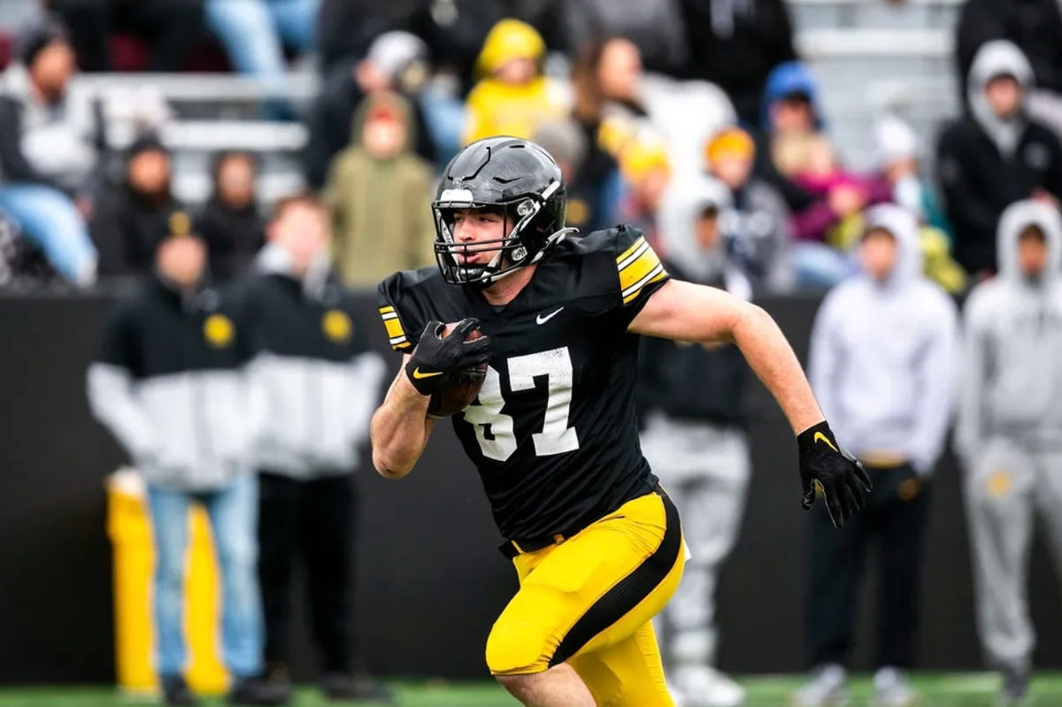 Iowa tight end Addison Ostrenga (87) runs for extra yards after a catch during the Hawkeyes' final spring NCAA football practice, Saturday, April 22, 2023, at Kinnick Stadium in Iowa City, Iowa.