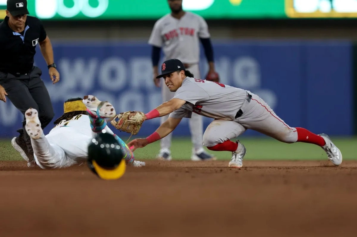 Jul 30, 2026; West Sacramento, California, USA; Athletics center fielder Lawrence Butler (4) slides under the tag of Boston Red Sox second baseman Anthony Seigler (48) during the sixth inning at Sutter Health Park. Mandatory Credit: Dennis Lee-Imagn Images