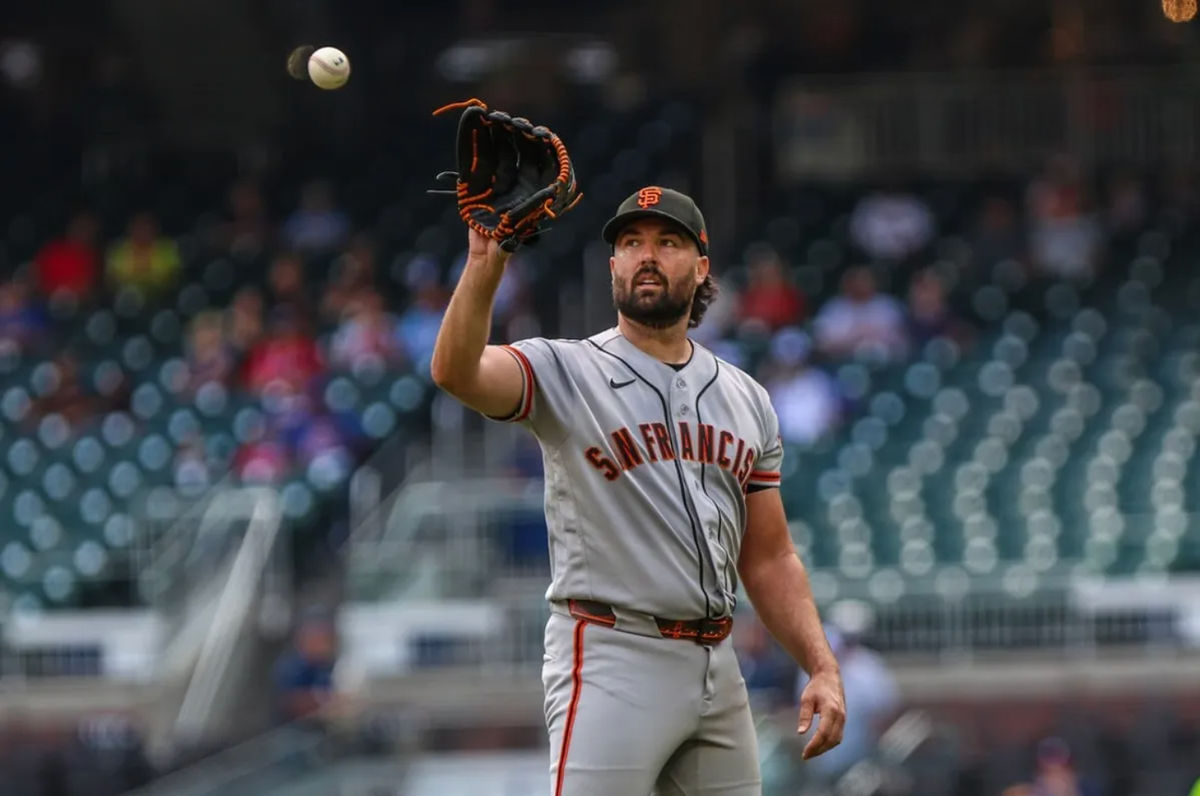 Jun 17, 2026; Cumberland, Georgia, USA; San Francisco Giants pitcher Robbie Ray (38) catches the ball after pitching against the Atlanta Braves during the third inning at Truist Park. Mandatory Credit: Jordan Godfree-Imagn Images