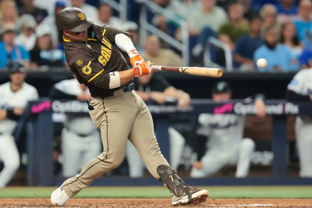 Jul 25, 2026; Miami, Florida, USA; San Diego Padres first baseman Ty France (25) hits a two-run single against the Miami Marlins during the third inning at loanDepot Park. Mandatory Credit: Sam Navarro-Imagn Images