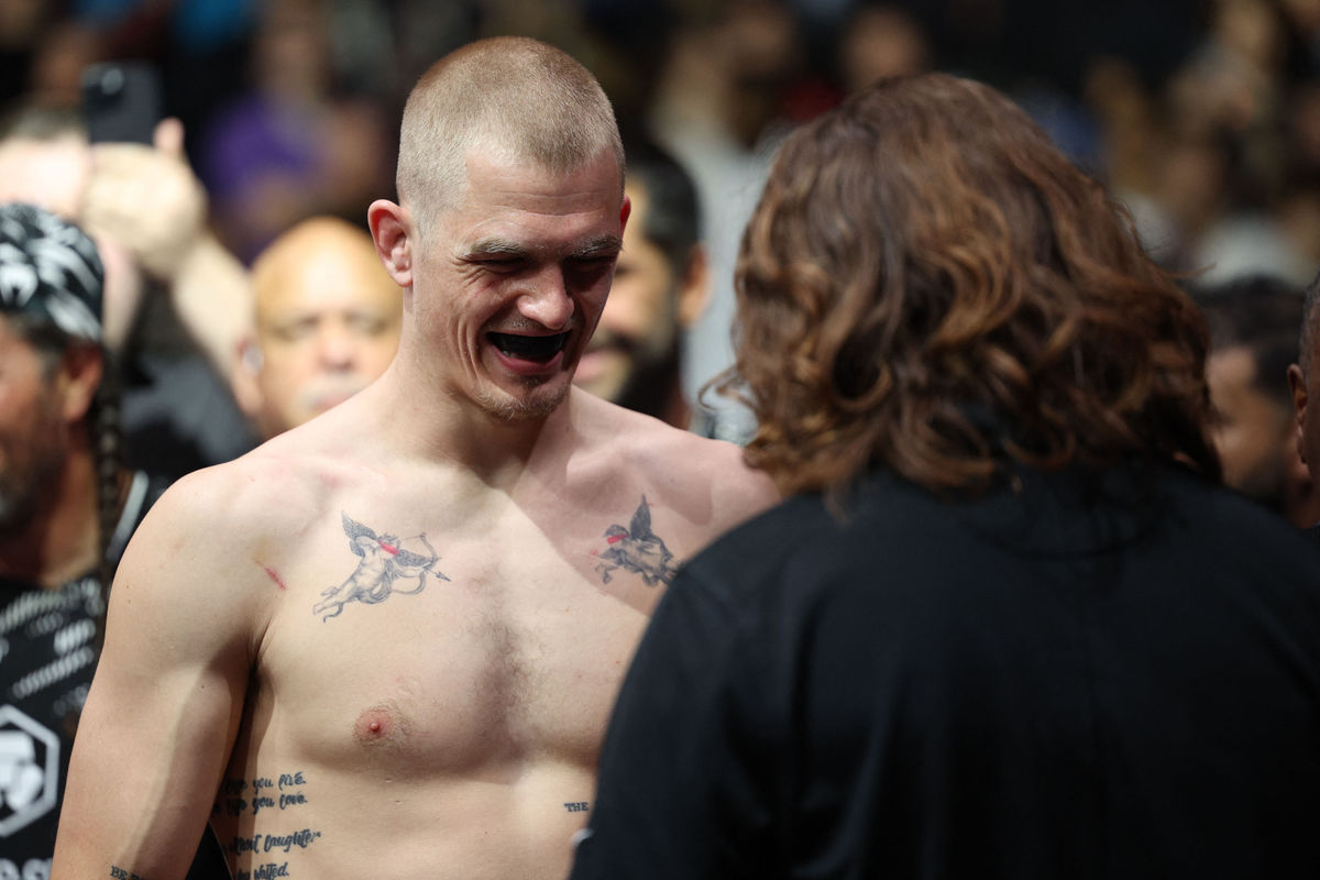 Apr 26, 2025; Kansas City, Missouri, UNITED STATES; Ian Machado Garry (red gloves) prepares to fight Carlos Prates (not pictured) during UFC Fight Night at T-Mobile Center. Mandatory Credit: William Purnell-Imagn Images