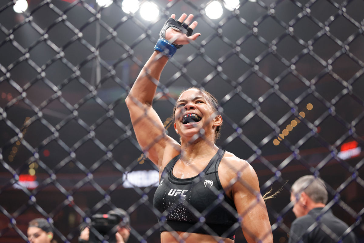 Jul 18, 2026; Oklahoma City, Oklahoma, USA; Dione Barbosa (blue gloves) celebrates after the fight against Anna Melisano (red gloves) during UFC Fight Night at Paycom Center. Mandatory Credit: Alonzo Adams-Imagn Images