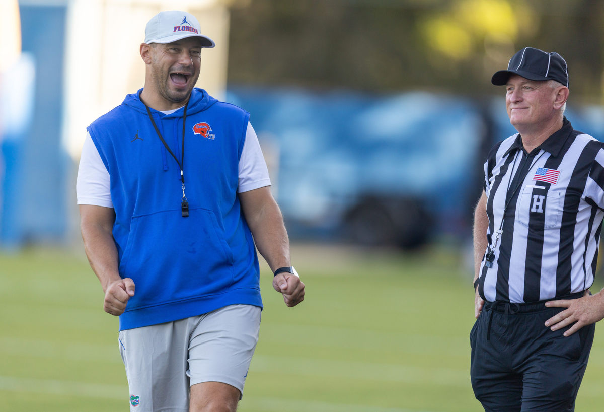 Florida Head Coach Jon Sumrall, left, watches practice with referees at Heavener Football Complex in Gainesville, FL on Tuesday, August 11, 2026. [Alan Youngblood/Gainesville Sun]