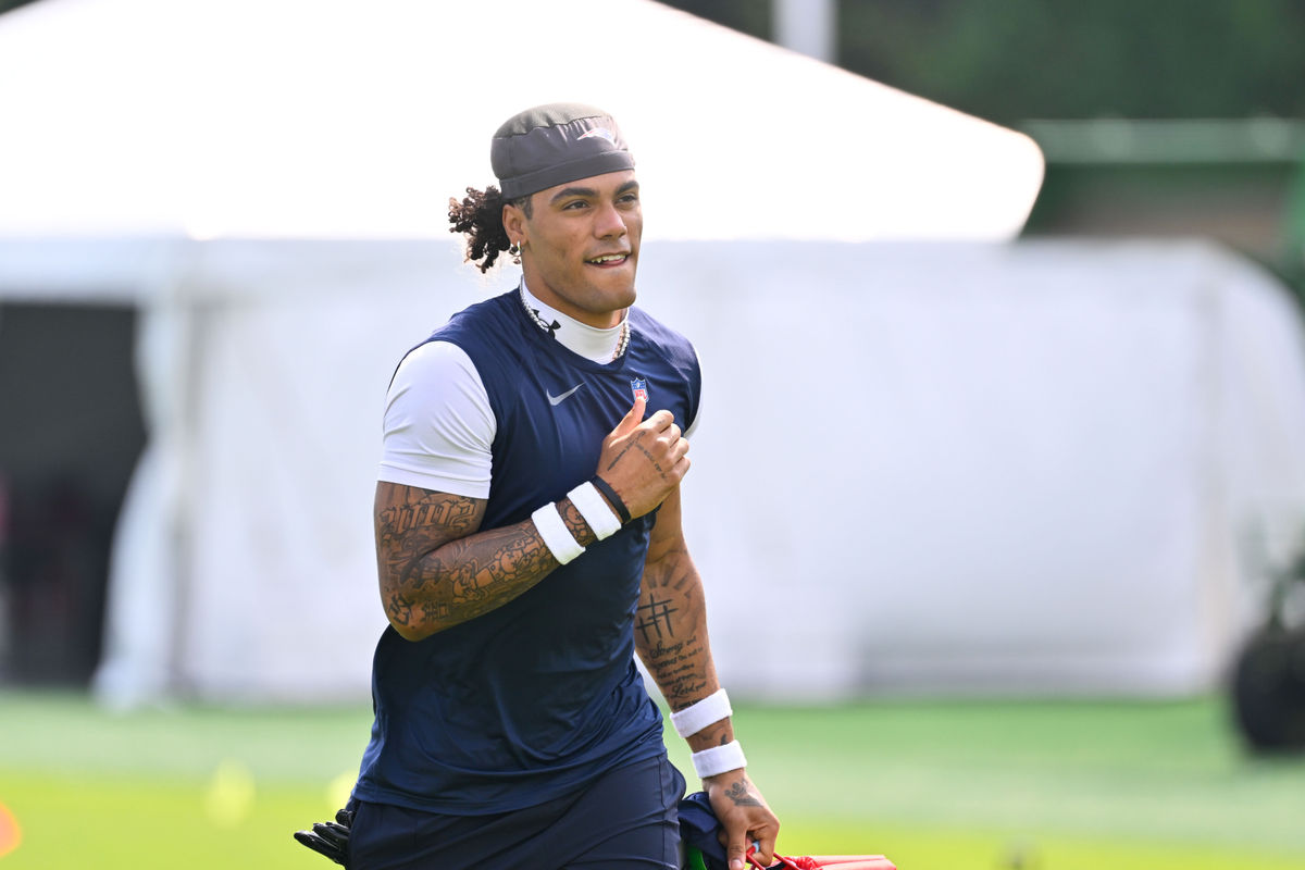 Jul 28, 2026; Foxborough, MA, USA; New England Patriots cornerback Christian Gonzalez (0) walks to practice for training camp at Gillette Stadium. Mandatory Credit: Eric Canha-Imagn Images