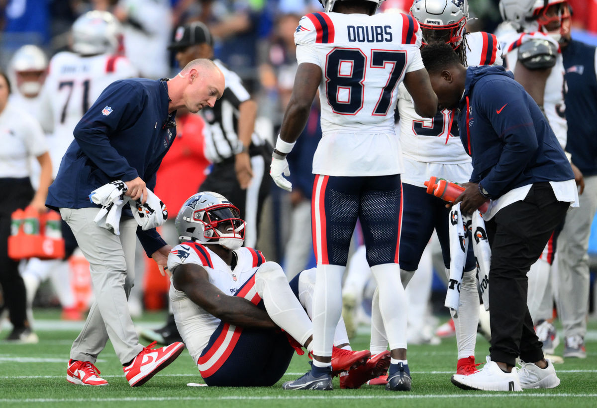 Sep 9, 2026; Seattle, Washington, USA; New England Patriots wide receiver A.J. Brown (1) reacts after an injury during the third quarter against the Seattle Seahawks at Lumen Field. Mandatory Credit: Steven Bisig-Imagn Images